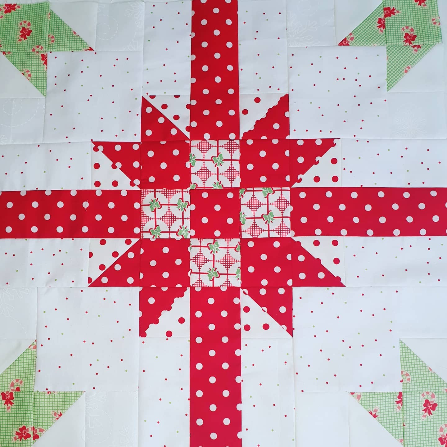 Test block for You're a Gift quilt in Christmas fabrics